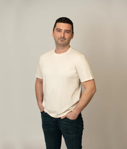 Male model wearing size L soft, sustainable organic cotton T-shirt.