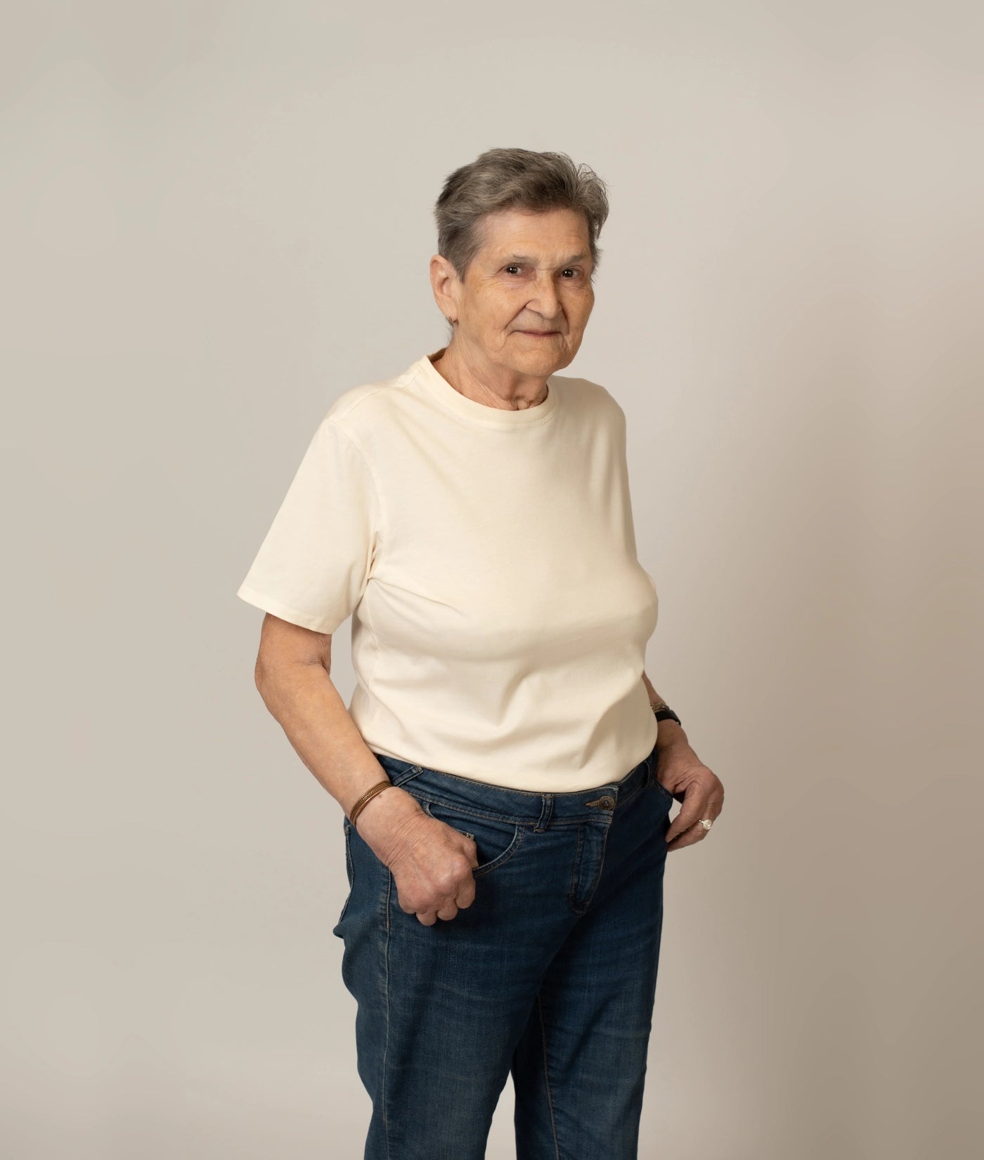 Female model wearing size S natural, eco-friendly organic cotton T-shirt.