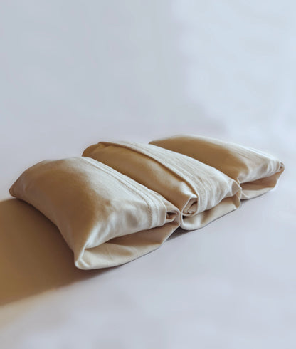 Bundle of three eco-friendly T-shirts made from natural, undyed, unbleached organic cotton.